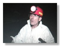 Robert Gentry examines dinosaur tracks in a coal mine